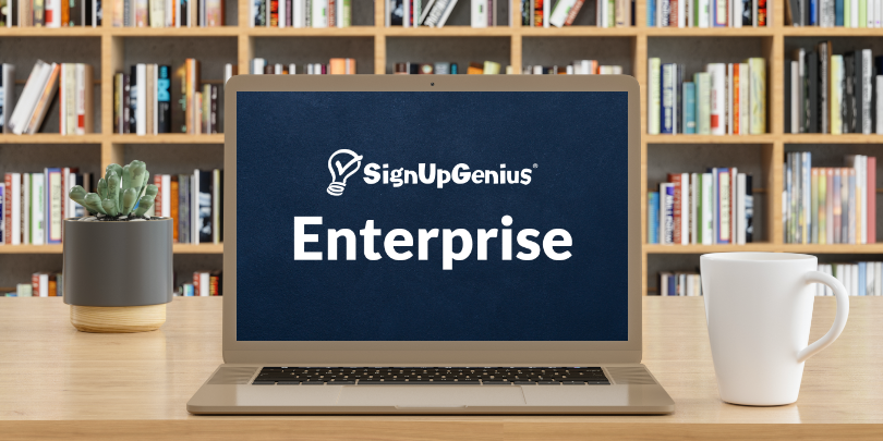 image of signupgenius enterprise logo on laptop in a library