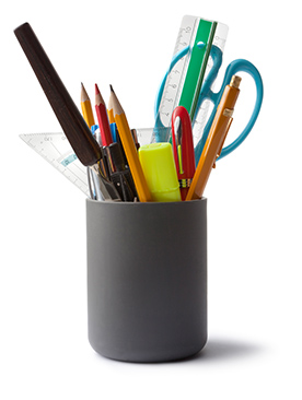 assorted office supplies in holder