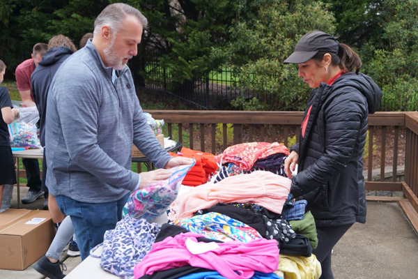 liberia mission trip team folding dresses