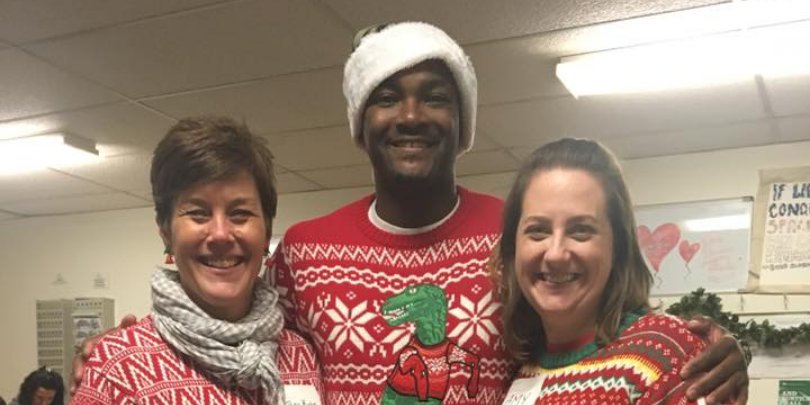 photo of heart to heart volunteers wearing christmas sweaters