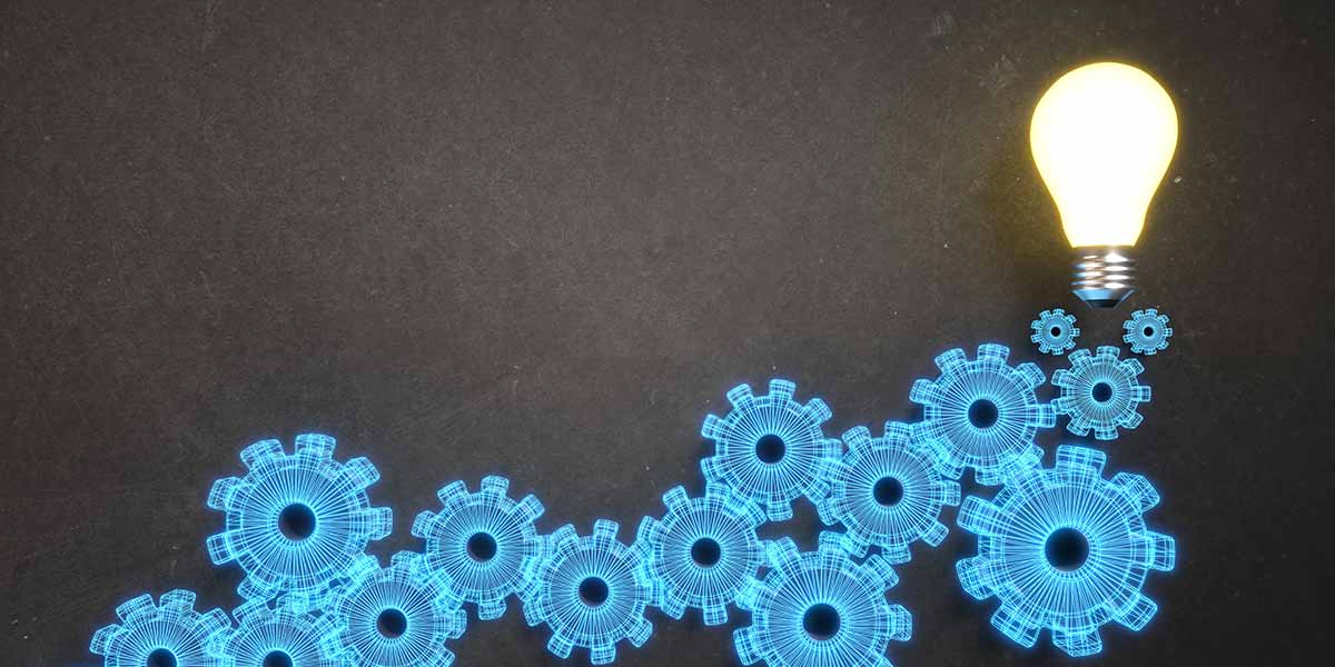 image of light bulb on top of rising blue gears