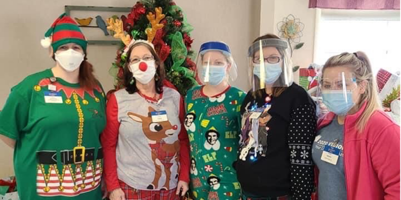 photo of nursing home volunteers dressed in Christmas costumes
