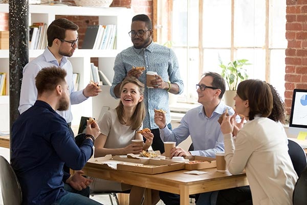 coworkers having lunch and sharing ideas and learning