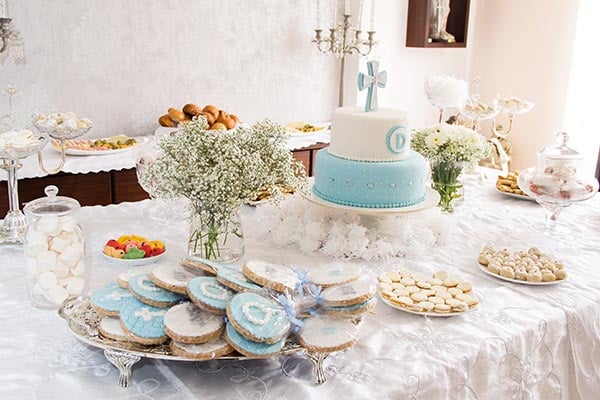 baptism celebration table with party gifts and snacks