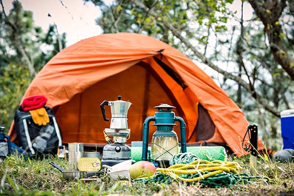 camping setup outdoors with tent and other camp supplies