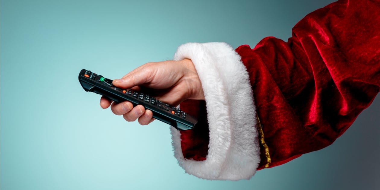 photo of Santa's arm holding a remote control