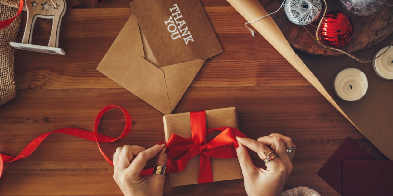 photo of thank you note and christmas gift on a table