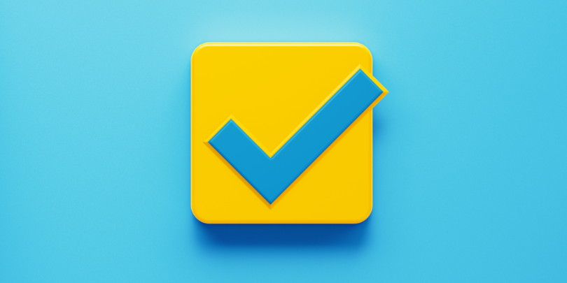 image of yellow checkmark push button on bright blue background