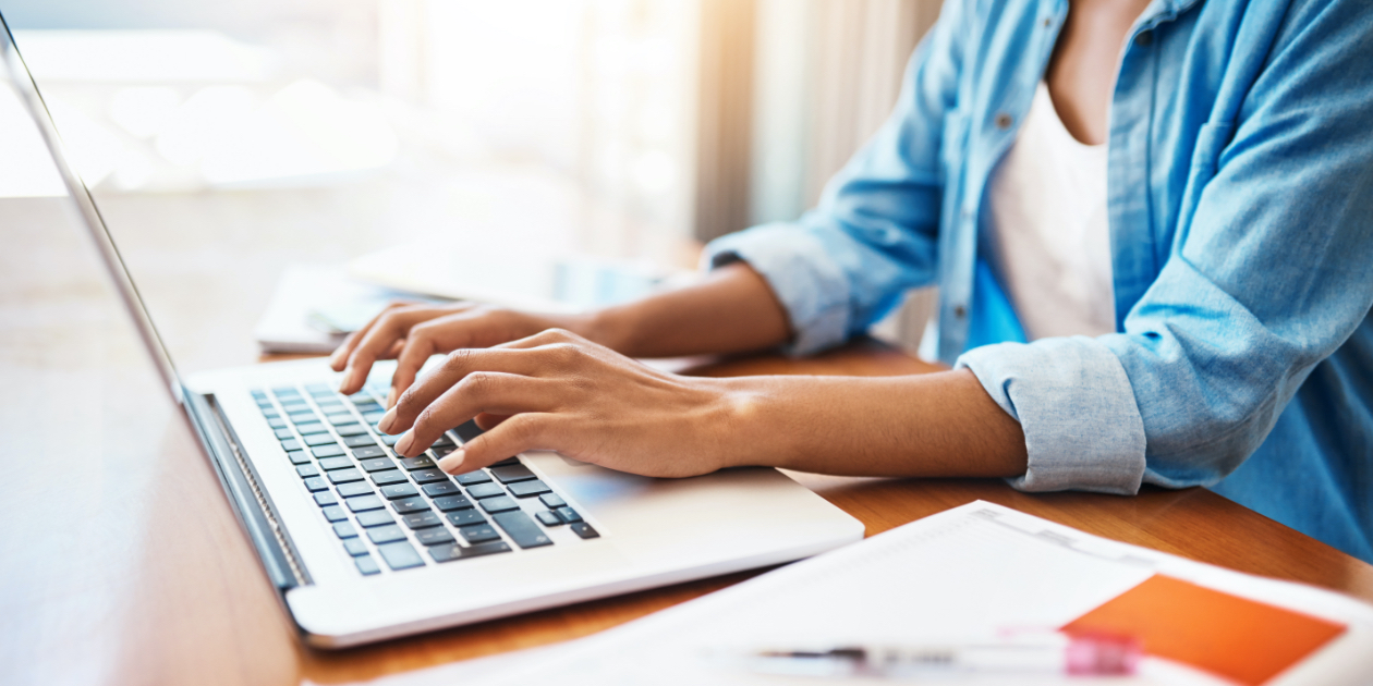 photo of woman working at a laptop