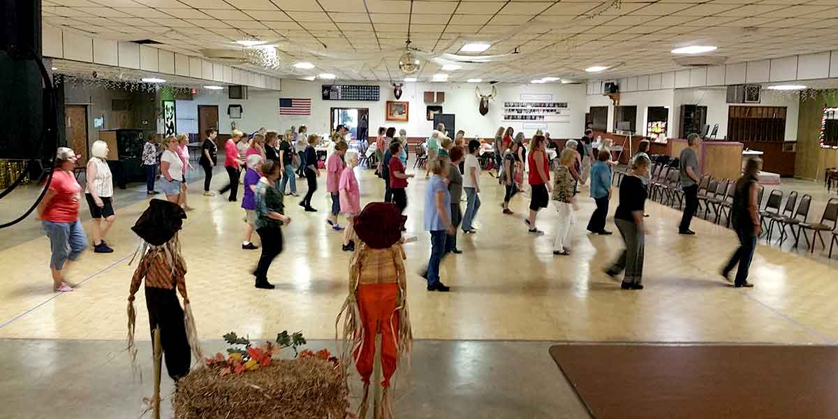 dance lessons raise money fundraising group organizing line dancing event