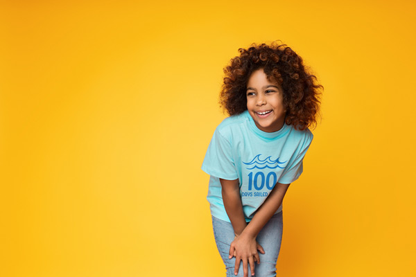 student wearing school shirt for 100th day of school