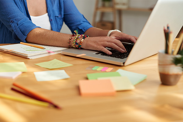 teacher planning parent conference on computer