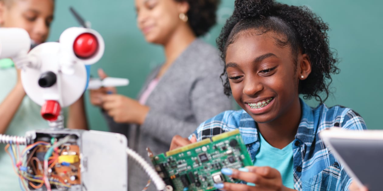 students doing technology in classroom