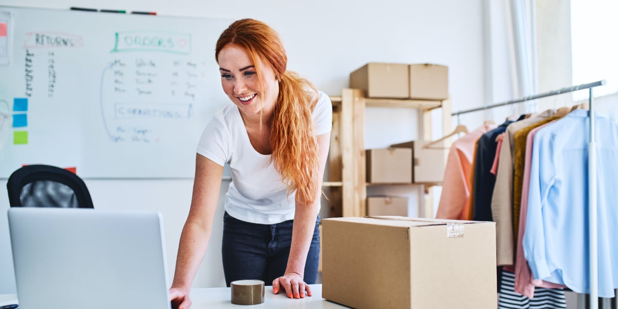 woman in home business looking at a laptop